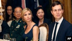 FILE - Ivanka Trump, second from right, the daughter and assistant to President Donald Trump, is seated with her husband, White House senior adviser Jared Kushner, right, during a dinner with President Donald Trump and Chinese President Xi Jinping at Mar-