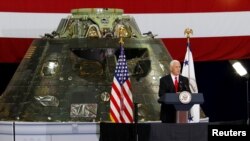 U.S. Vice President Mike Pence visits the Kennedy Space Center in Florida July 6, 2017. Behind Pence is an Orion Capsule that will be launched at a future date.