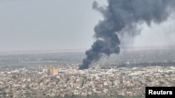 Drone footage shows dense smoke rising from fires near capital Khartoum