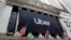 An Uber banner hangs on the facade of the New York Stock Exchange, May 10, 2019. 