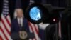El presidente de los Estados Unidos, Joe Biden, visto a través de la mirilla de una cámara durante su visita al Departamento de Estado en Washington el 4 de febrero del 2021. 