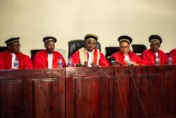 Judge Charles Ndayiragije (C), President of Burundi's constitutional court, speaks during the final announcements of the country's general and presidential elections in Bujumbura, June 4, 2020.