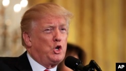 President Donald Trump in the East Room of the White House, Tuesday, Feb. 13, 2018, in Washington. 