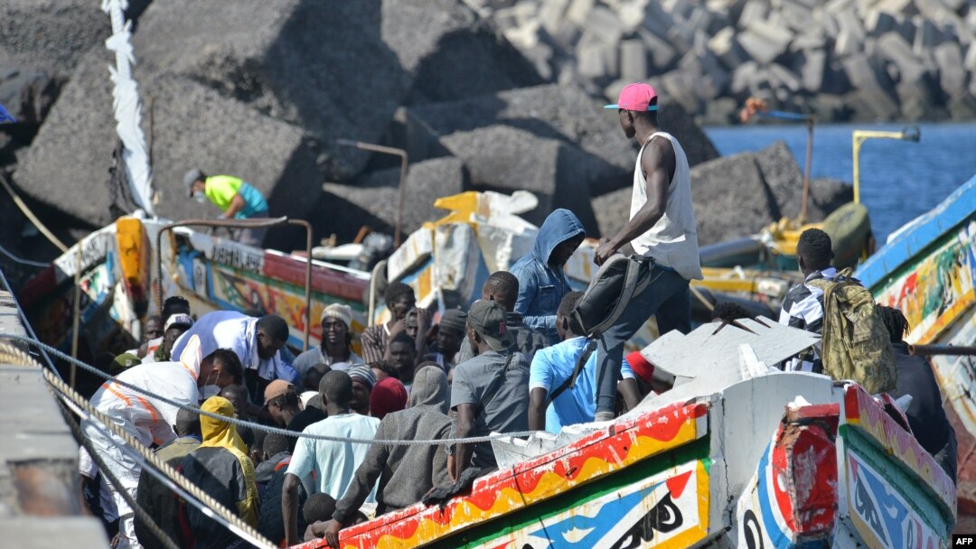 FILE - Migrants wait to disembark from a boat at La Restinga dock, in the municipality of El Pinar on the Canary Island of El Hierro, on October 31, 2023.