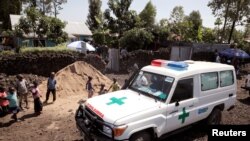 FILE - An ambulance waits next to a health clinic to transport a suspected Ebola patient, in Goma, Democratic Republic of Congo, Aug. 5, 2019.