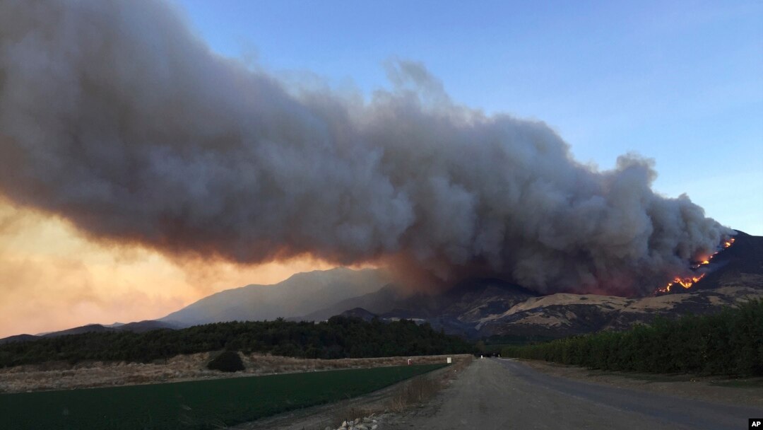 A wildfire burns off of the hills next to CA-126 highway, just northwest of Fillmore, California, Dec. 7, 2017. 
