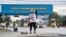 A dockworker demonstrates after a shipping port strike went into effect across the East Coast at the Port of Wilmington, Del., Oct. 1, 2024
