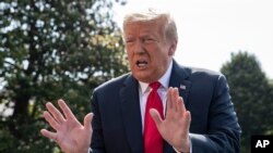 FILE - President Donald Trump speaks with reporters before departing on Marine One on the South Lawn of the White House, June 23, 2020.