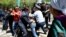File - Riot police officers detain demonstrators during a protest against President Nursultan Nazarbayev's government and the land reform it has proposed, in Almaty, Kazakhstan, May 21, 2016.