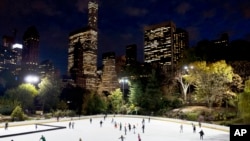 FILE - Skaters take to the ice at Wollman Rink in New York's Central Park, Nov. 3, 2016. 
