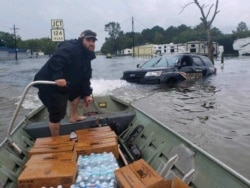 A volunteer from The Cajun Navy Relief and Rescue helps deliver supplies in the aftermath of Hurricane Harvey in 2017. (Courtesy: Cajun Navy Relief and Rescue)