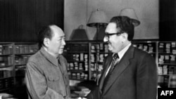 FILE - US Secretary of State Henry Kissinger, right, meets with Chinese president Mao Zedong, on Nov. 24, 1973 in Beijing.