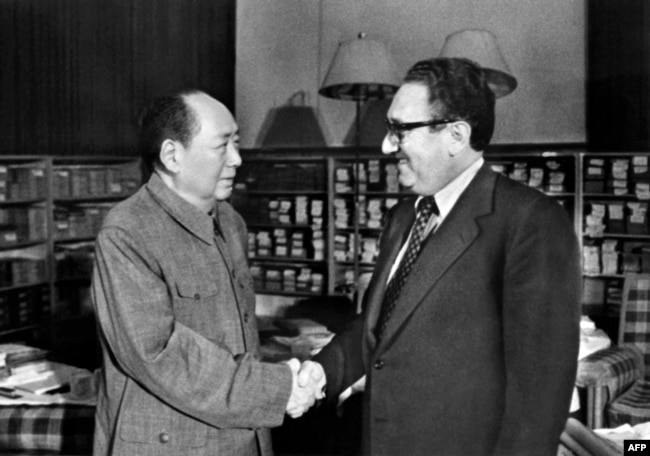 FILE - US Secretary of State Henry Kissinger (R) meets with Chinese President Mao Zedong (L), November 24, 1973 in Beijing. (Photo by AFP)