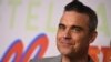 Penyanyi pop asal Inggris Robbie Williams merilis serial dokumenter seputar kehidupannya beberapa waktu lalu di London. (Foto: Jordan Strauss/Invision/AP)