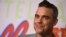 Penyanyi pop asal Inggris Robbie Williams merilis serial dokumenter seputar kehidupannya beberapa waktu lalu di London. (Foto: Jordan Strauss/Invision/AP)
