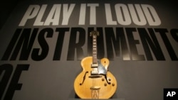 A guitar played by Chuck Berry is displayed at the entrance to the exhibit "Play It Loud: Instruments of Rock & Roll" at the Metropolitan Museum of Art in New York, April 1, 2019. 