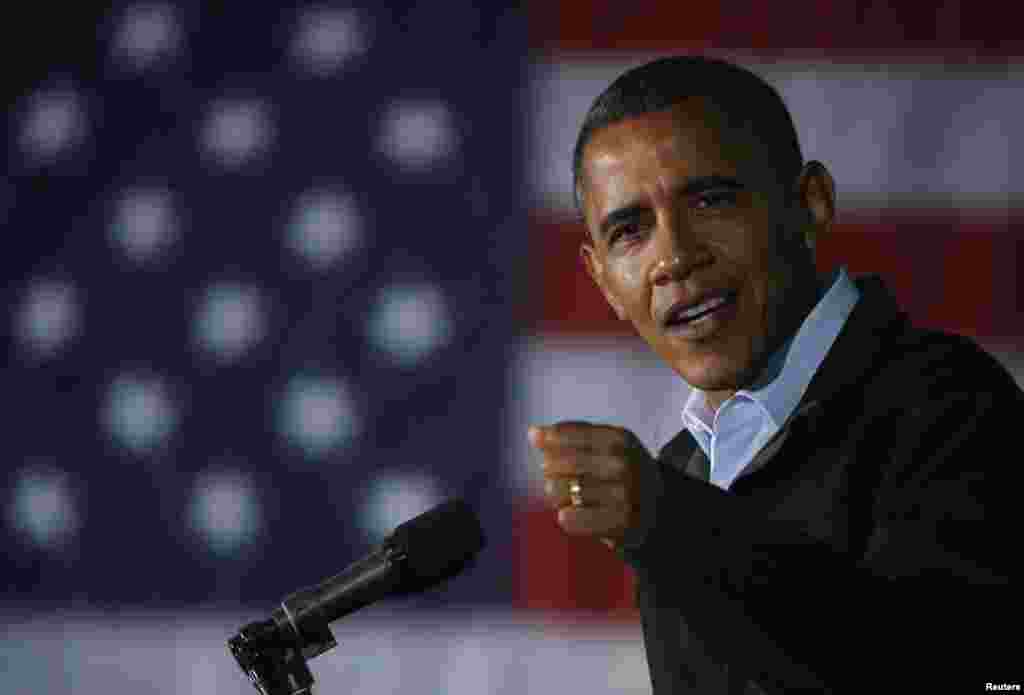 Trainers direct dolphins performing at a dolphinarium in Pyongyang, North Korea.
