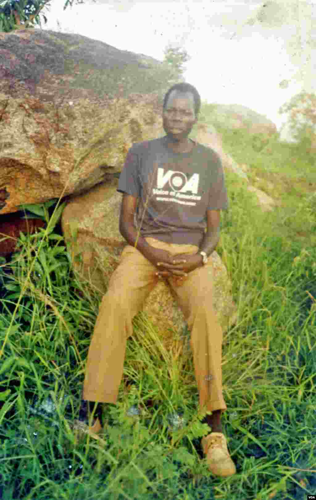 John Bosco Komanakech, a student at Koch Primary School in Gulu, Uganda gets his news from VOA.