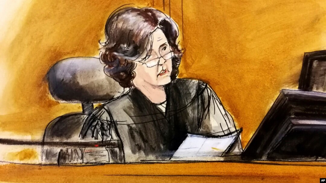 FILE - In this courtroom sketch, U.S. District Judge Kimba Wood presides over a federal court hearing where attorneys for President Donald Trump and Michael Cohen, then the president's personal attorney, tried to persuade the judge to delay prosecutors from examining records and electronic devices seized in raids on the ground that many of them were protected by attorney-client privilege, April 16, 2018, in New York.