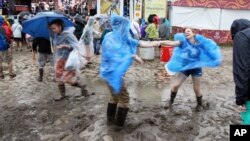 Joe Robert of Baton Rouge, Louisiana, and Margo Carey of Bethany Beach, Delaware dance to the music of Rockin' Dopsie Jr. and his Zydeco Twisters at the New Orleans Jazz and Heritage Festival, May 1, 2016.