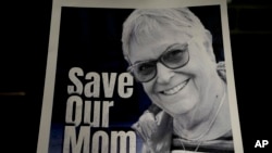 FILE —A poster of Ada Sagi, 75-year-old mother of Noam Sagi, is on display at a press conference of British children of Israeli hostages at a hotel in London, Thursday, Oct. 12, 2023.