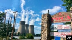 FILE - American Electric Power’s John Amos coal-fired plant in Winfield, West Virginia, is seen from the town of Poca across the Kanawha River, Aug. 23, 2018. 