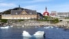 FILE - Small pieces of ice float in the water off the shore in Nuuk, Greenland, June 13, 2019. U.S. President-elect Donald Trump has said that acquiring Greenland, a sovereign Danish territory, is vital for U.S. security.