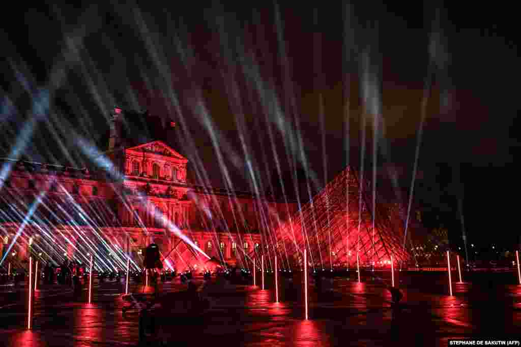 The stage set up for French DJ David Guetta&#39;s 2021 New Year&#39;s eve livestream charity concert &quot;United at Home&quot; is in the Cour Napoleon, with the Louvre Pyramid, designed by Ieoh Ming Pei, in Paris, France, Dec. 29, 2020.