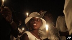 A group of Haitians mark the first anniversary of the magnitude-7.0 earthquake with a candlelight vigil and march in Port-au-Prince, 12 Jan., 2011.