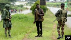 FILE: Soldiers patrol the streets as protestors gather during a demonstration over the hike in fuel prices in Harare, Zimbabwe, Tuesday, Jan. 15, 2019.