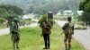 Soldiers patrol the streets as protestors gather during a demonstration over the hike in fuel prices in Harare, Zimbabwe, Tuesday, Jan. 15, 2019. 
