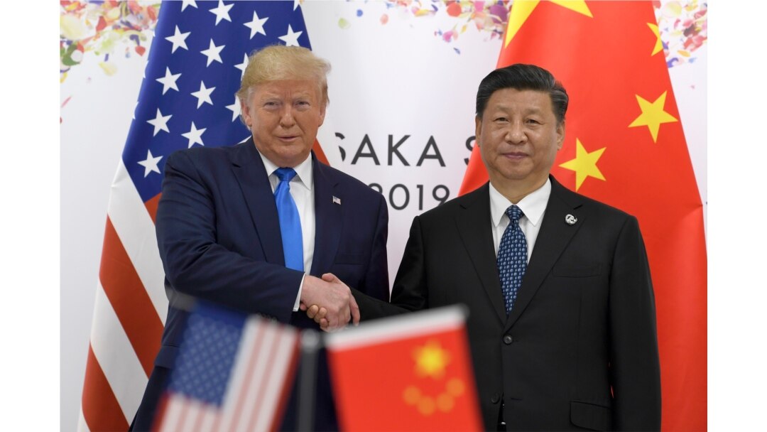 FILE - President Donald Trump, left, shakes hands with Chinese President Xi Jinping during a meeting on the sidelines of the G-20 summit in Osaka, Japan, June 29, 2019.