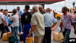 Cubans line up to buy fuel at a gas station in Havana, Sept. 12, 2019. President Miguel Diaz Canel blamed the United States for Cuba's fuel shortage.