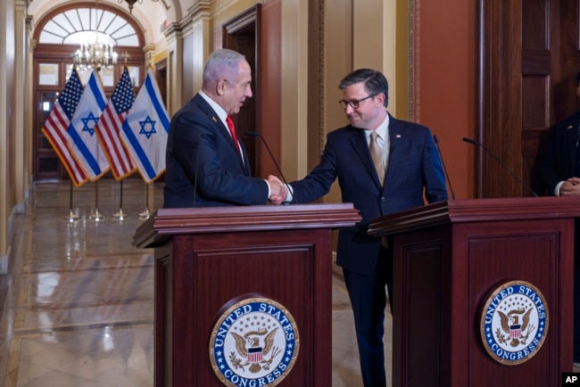 Israeli Prime Minister Benjamin Netanyahu, left, and House Speaker Mike Johnson, R-La., shake hands following their discussions at the Capitol in Washington, Feb. 7, 2025.