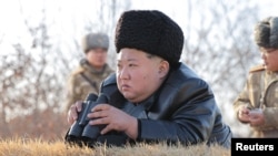 North Korean leader Kim Jong Un supervises what state media KCNA says is a test launch of a missile over the sea off the west coast of the Korean peninsula, Feb. 26, 2025, in this photo released by North Korea's official Korean Central News Agency.