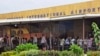 FILE - People stand in line at the Roberts International Airport in Monrovia, Liberia, Aug. 24, 2014. The 2024 Africa-Indian Ocean Aviation Week produced plans to make improvements to aviation development and safety, attendees say.