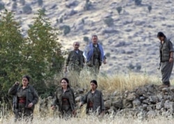 FILE - Members of the Kurdistan Workers' Party, or PKK, are seen in the Kandil mountain range, Iraq, Aug. 13, 2011.