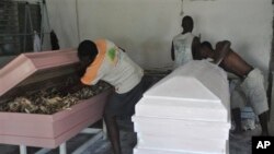 A carpenter makes new caskets for sale in New Kru in Monrovia, Liberia on October 22, 2014. 