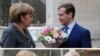 Меркель и «тандемократия»: попытка танго втроем