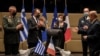 French Defense Minister Florence Parly and her Greek counterpart applaud after the signing of an agreement for the purchase of 18 Rafale fighter jets at the Greek Defense Ministry in Athens, Jan. 25, 2021. (Louiza Gouliamaki/Pool via Reuters)