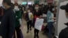 FILE - Parents and children at a children's hospital in Beijing on Oct. 30, 2023, during a surge in respiratory illnesses across China. 