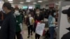 Parents and children at a children's hospital in Beijing on Oct. 30, 2023, during a surge in respiratory illnesses across China. 