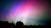 FILE - The northern lights flare in the sky over a farmhouse, late Friday, May 10, 2024, in Brunswick, Maine. 