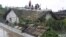Residents wait on the roof of a flooded building in Anju City, South Phyongan Province, North Korea, July 30, 2012.