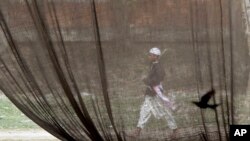  A Bangladeshi scientist has found a way to turn jute - shown being used as a tent - into low-cost biodegradable cellulose sheets that can be made into greener throw-away bags that look and feel much like plastic ones.