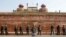 Policemen stand guard in front of the historic Red Fort after Tuesday's clashes between police and farmers, in the old quarters of Delhi, India, January 27, 2021. 
