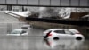 Cars sit in floodwaters at a railroad underpass in Louisville, Kentucky, Feb. 16, 2025.