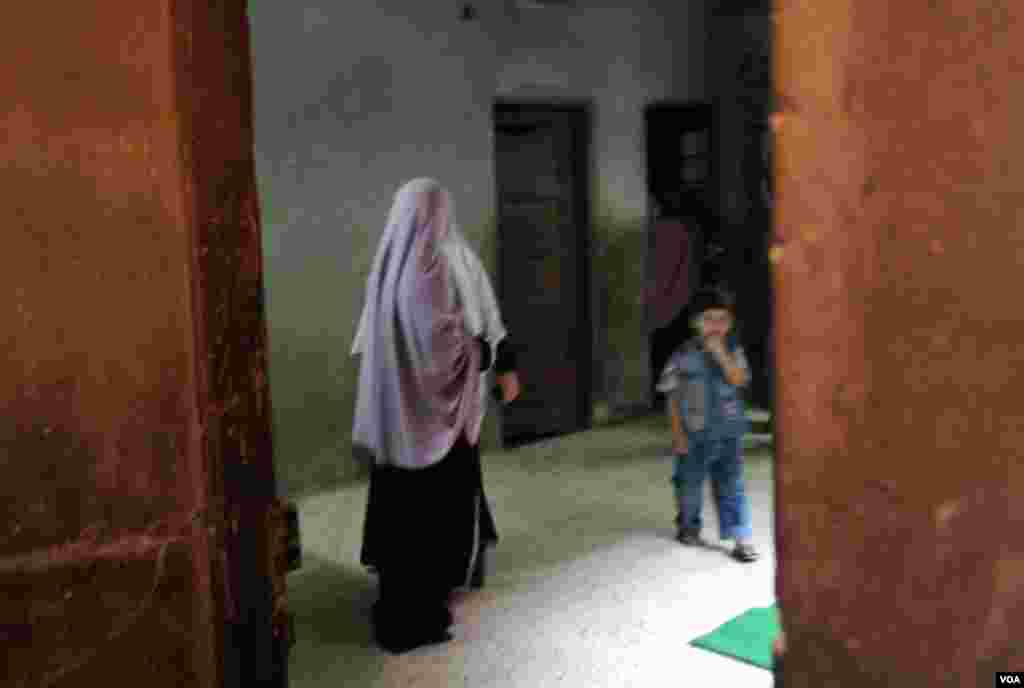 The Morsi village home has a traditional, separate floor for women. (E. Arrott/VOA)