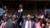 Kenya's presidential candidate Uhuru Kenyatta (C) and his running mate William Ruto (2nd L) celebrate winning the presidential election with supporters after the official result was released in Nairobi, March 9, 2013. 