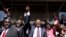 Kenya's presidential candidate Uhuru Kenyatta (C) and his running mate William Ruto (2nd L) celebrate winning the presidential election with supporters after the official result was released in Nairobi, March 9, 2013. 